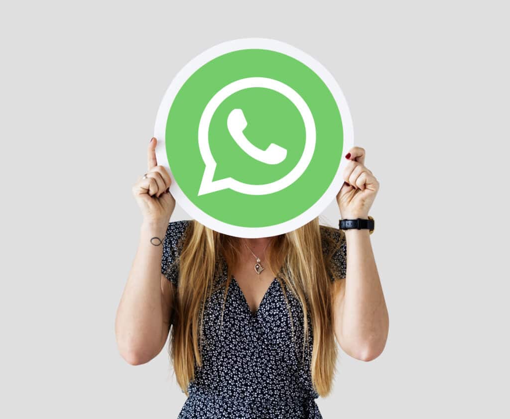 woman showing whatsapp messenger icon